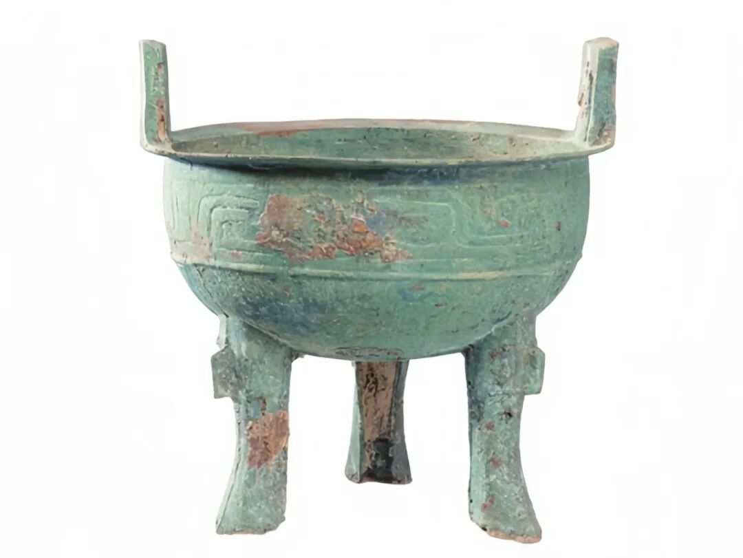 花瓶里插着绿色的雕塑描述已自动生成