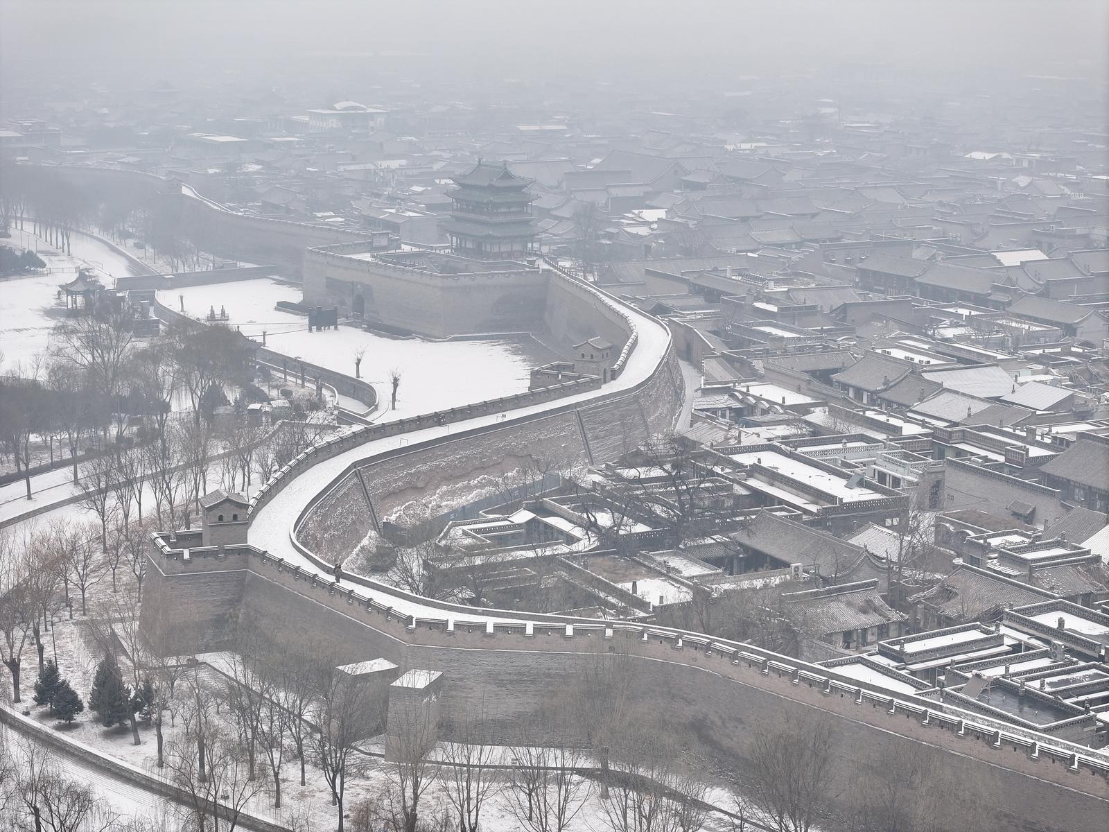 1月25日,平遥古城迎来降雪,雪中古城,银装素裹,美如画卷。